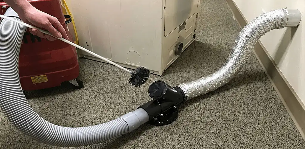 Dryer vent cleaning service removing lint from a dryer duct connection in Boca Raton, FL