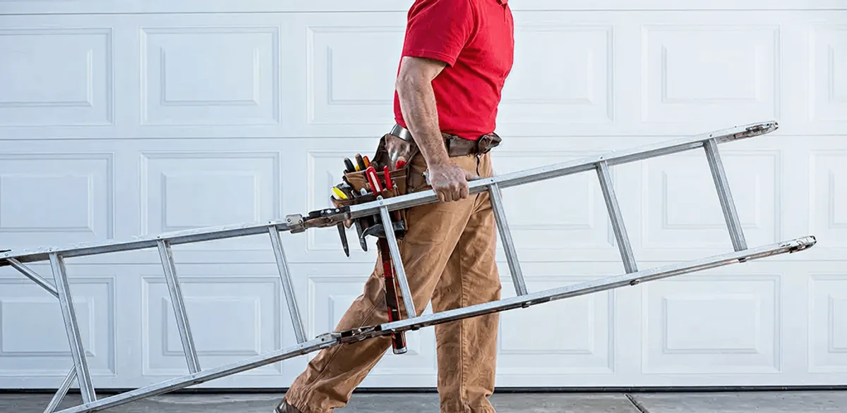 Garage door repair technician arriving with tools and ladder in Boca Raton, FL