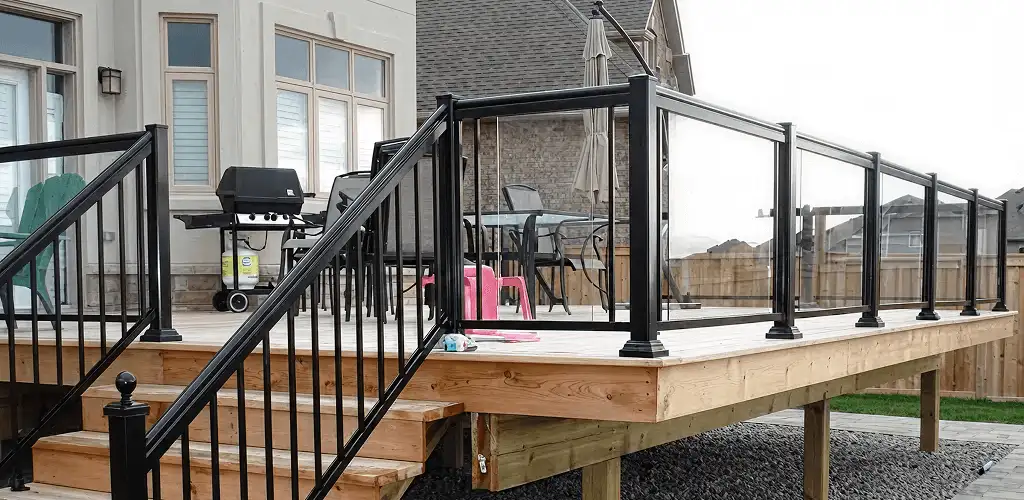 Handrail installation on a deck staircase for safety and code compliance in Boca Raton, FL