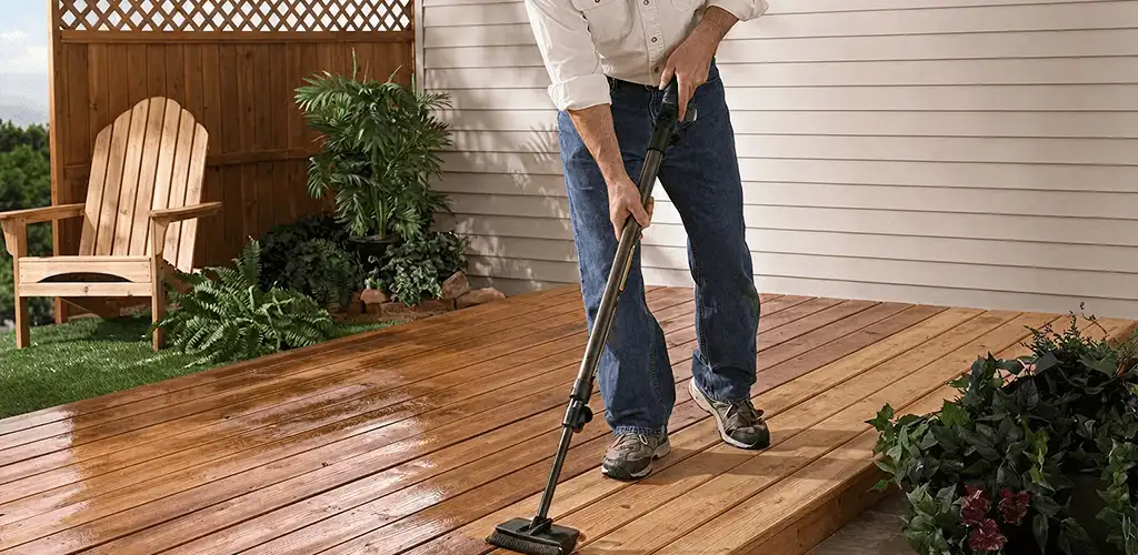 Deck staining service applying stain to a backyard wood deck in Boca Raton, FL